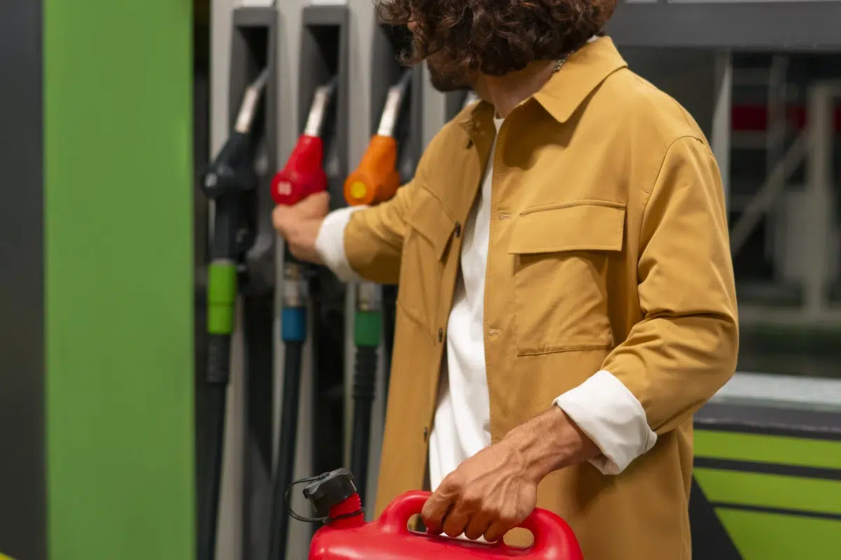 side view man at gas station thinking shell super vs pertamax